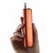 IQOS ILUMA i One Vivid Terracotta in hand